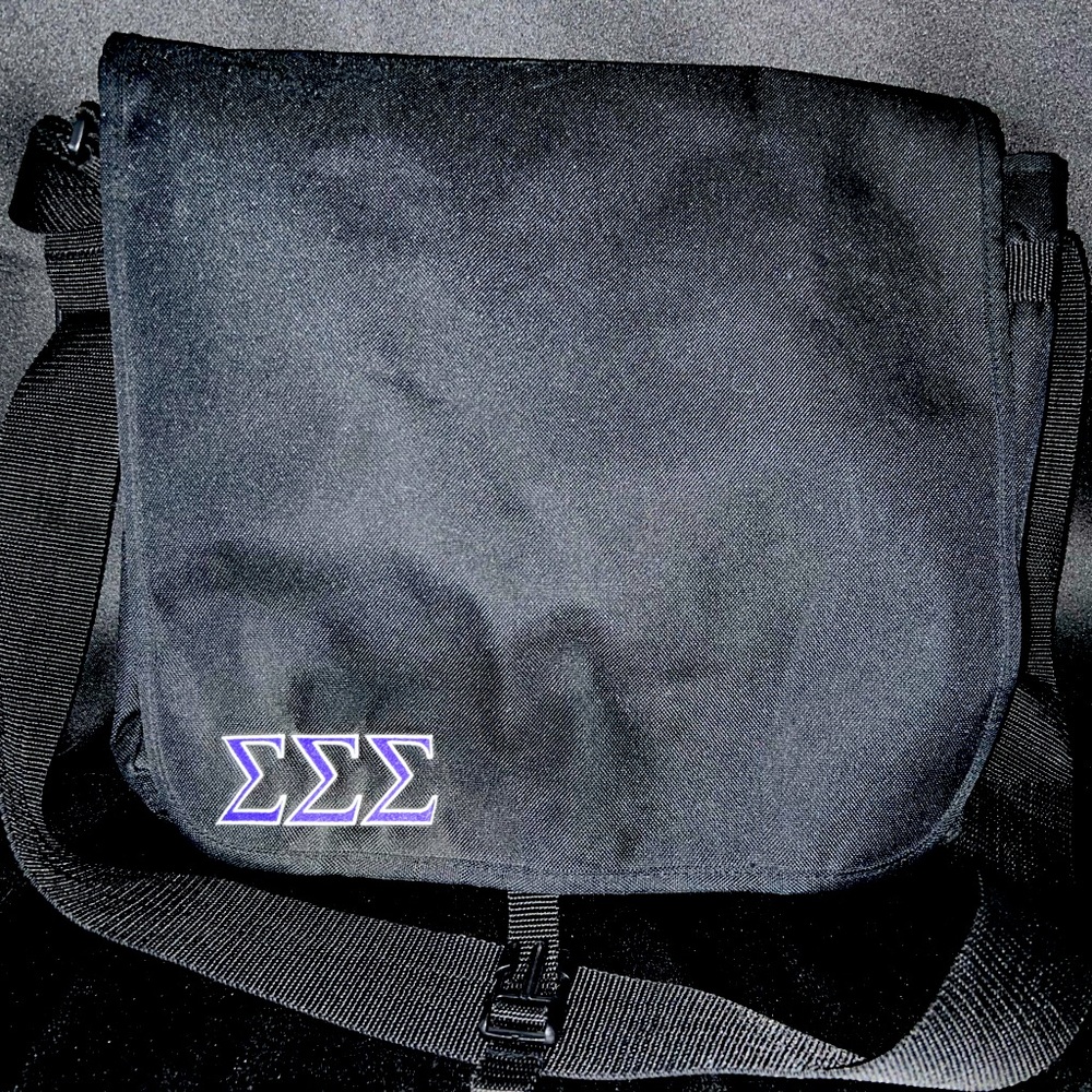 Sigma Sigma Sigma Sorority messenger bag with purple embroidered Greek letters.